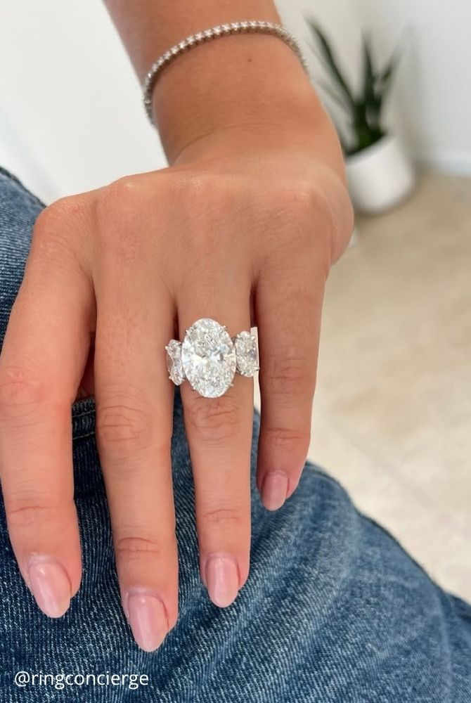 oval engagement rings three stone engagement ring featuring massive oval cut diamond center ringconcierge