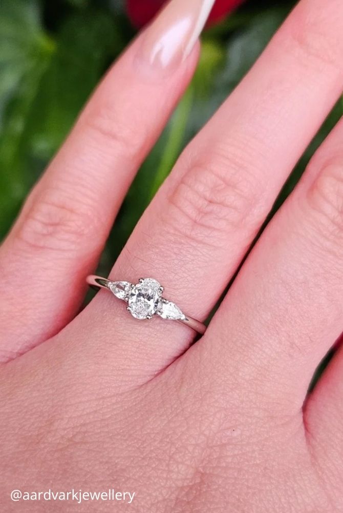 oval engagement rings three stone engagement ring featuring oval cut center and pear side diamonds aardvarkjewellery