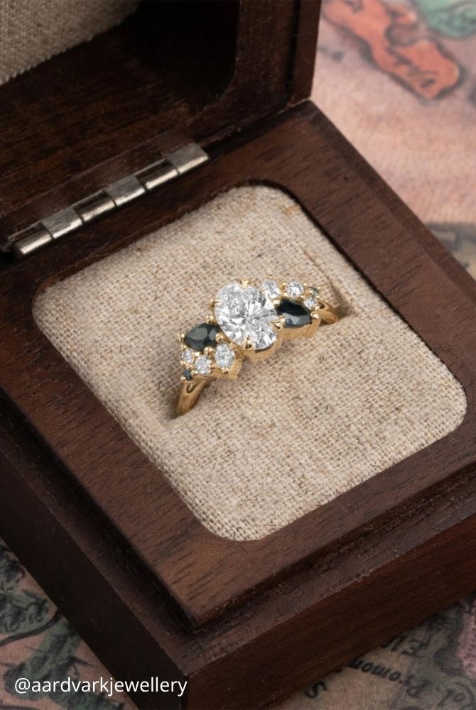 oval engagement rings vintage style oval cut diamond ring with dark blue side stones in yellow gold aardvarkjewellery