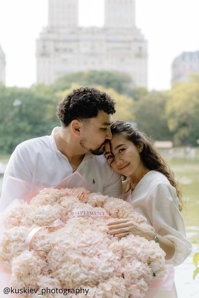 cheap proposal ideas happy bride hug ring ring on finger big bouquet of roses kuskiev photography