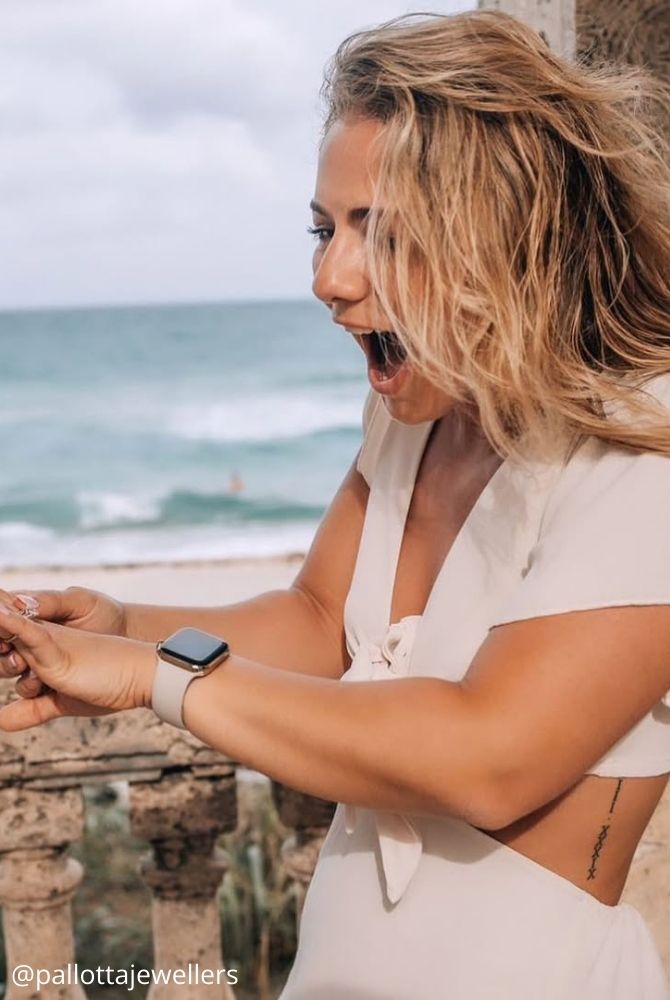 cheap proposal ideas happy girl impressive surprise surprised looks at wedding ring pallottajewellers