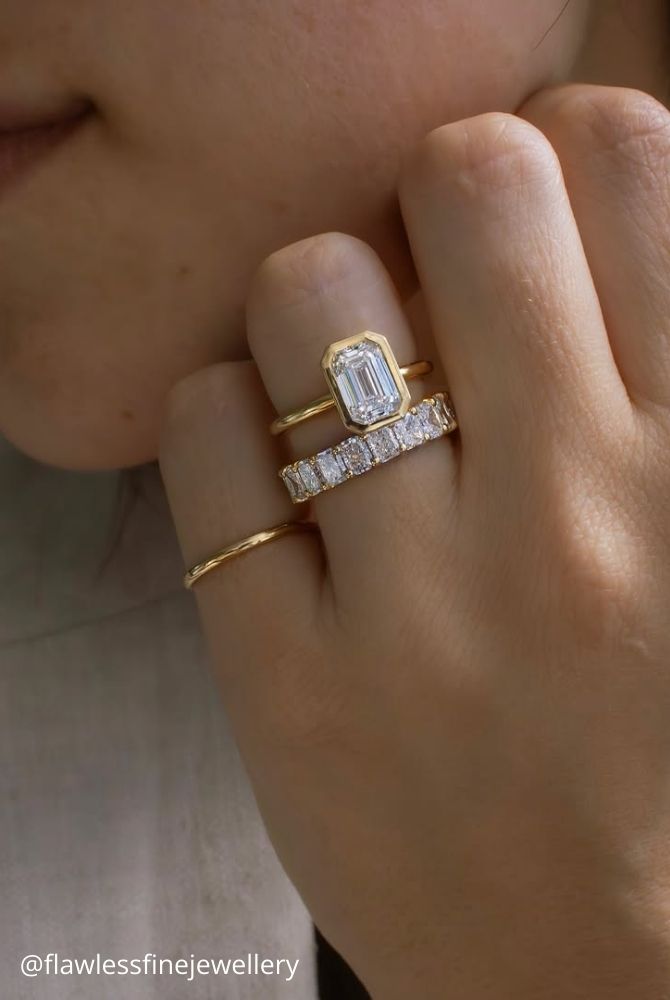 diamond wedding rings emerald cut diamond bezel set ring with baguette diamond eternity band in yellow gold flawlessfinejewellery