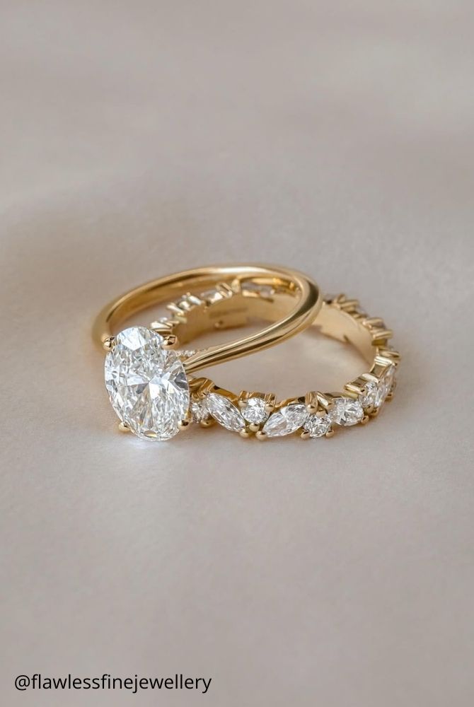 diamond wedding rings oval diamond solitaire engagement ring with stackable marquise diamond wedding band in yellow gold flawlessfinejewellery