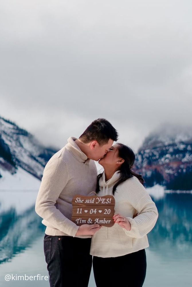 engagement photos creative proposal man happy she said yes kiss with table inscription she said yes kimberfire