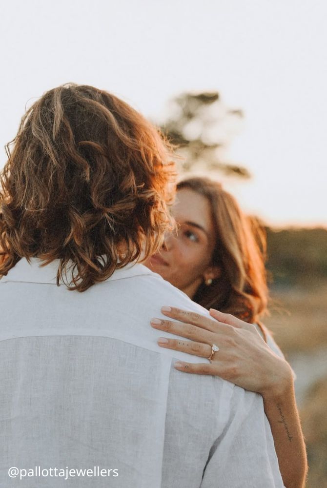 engagement photos hugs newlyweds romantic photo at sunset ring on hand pallottajewellers