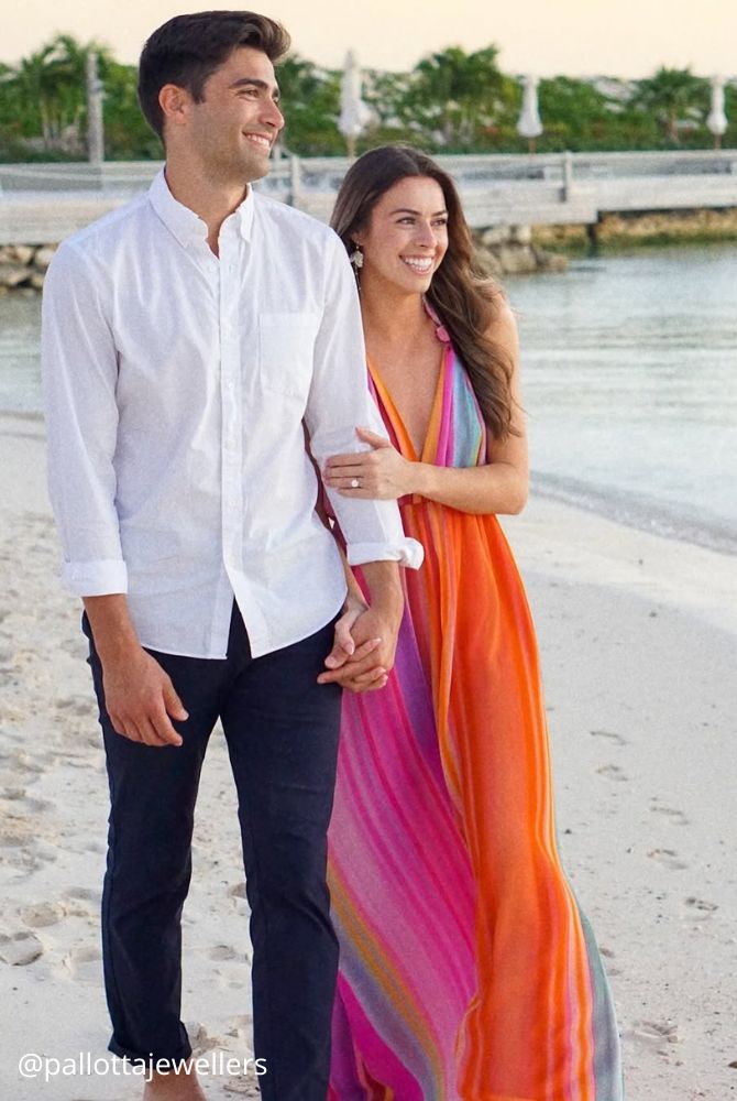 engagement photos hugs newlyweds romantic photo walk in summer on the beach pallottajewellers