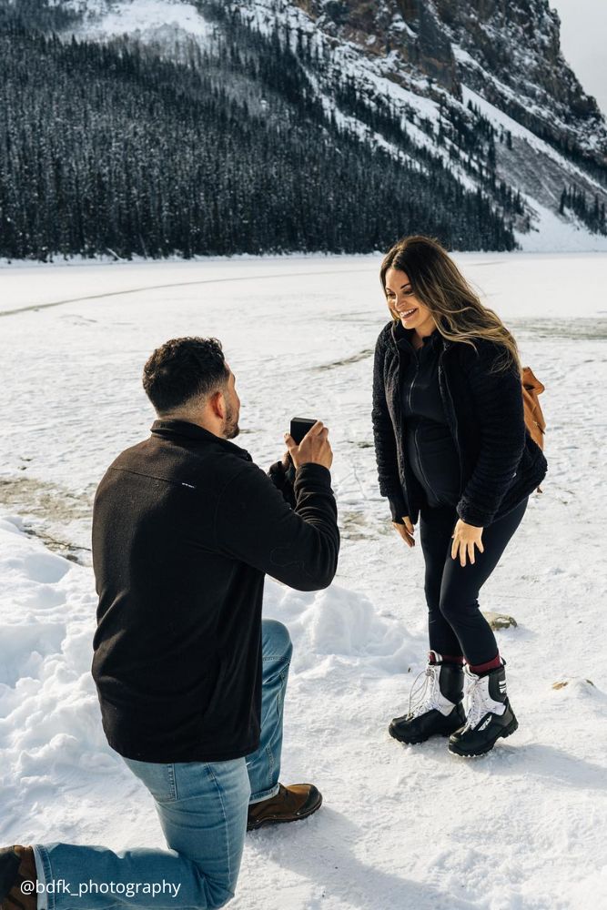 christmas proposal guy proposes to a girl in the snowy mountains bdfk photography