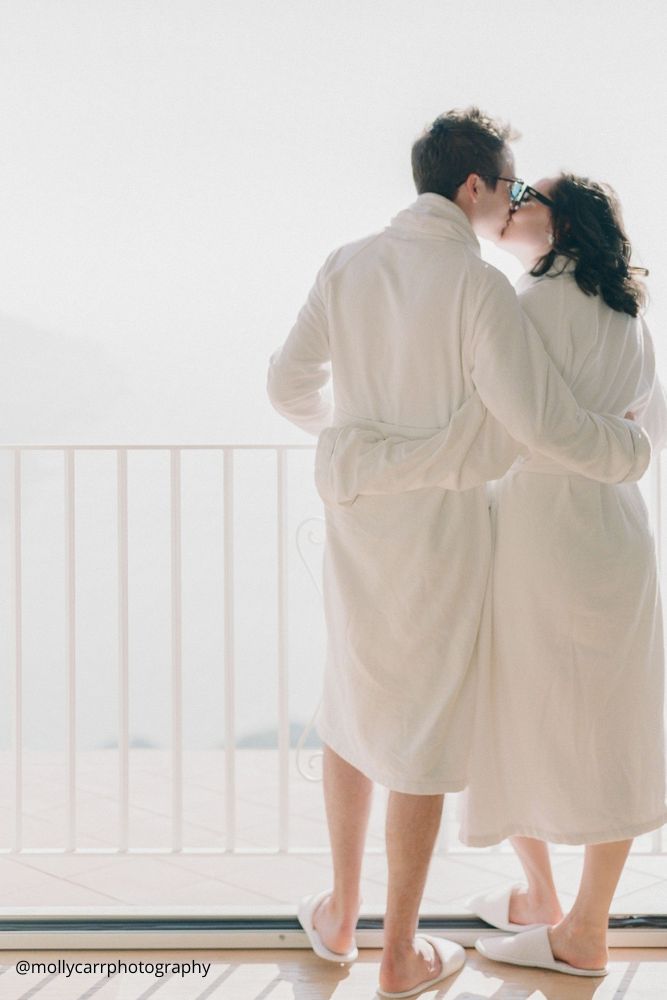 valentines day proposal love couple in white robes kissing in the hotel mollycarrphotography