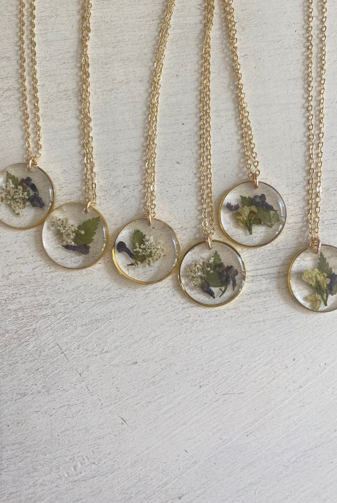 pressed flowers necklaces with white and blue flowers